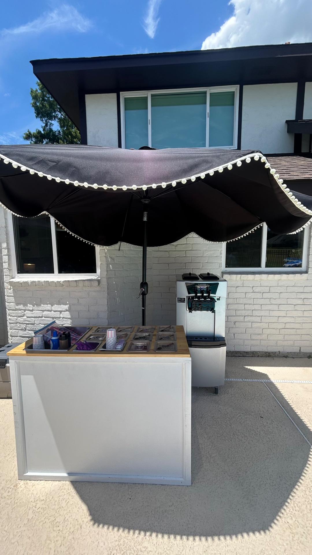 Backyard soft serve cart under the umbrella